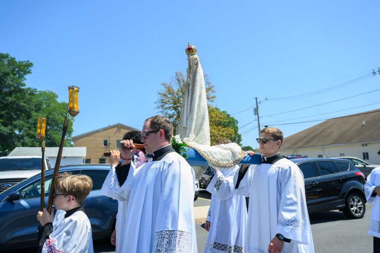 With Masses and processions, faithful honor Mary on Assumption Feast