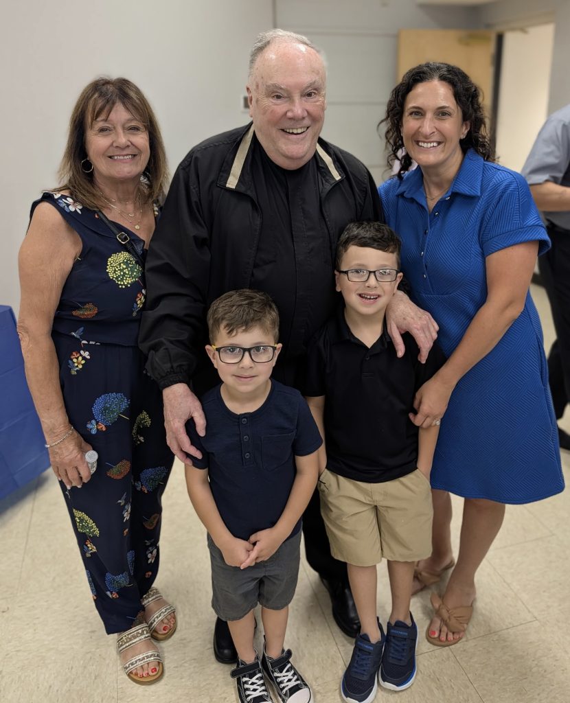 RET Roberts_with parishioners