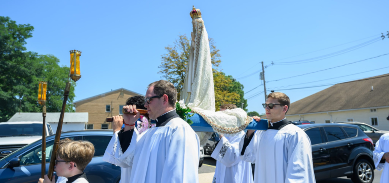 With Masses and processions, faithful honor Mary on Assumption Feast